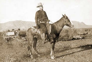Sepia photograph of Frank Hamer on horseback.
