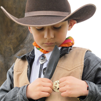 A Junior Ranger pinning on his badge.